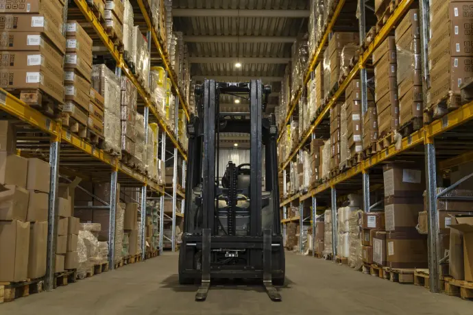 Warehouse Close up of warehouse storage with forklift in the center