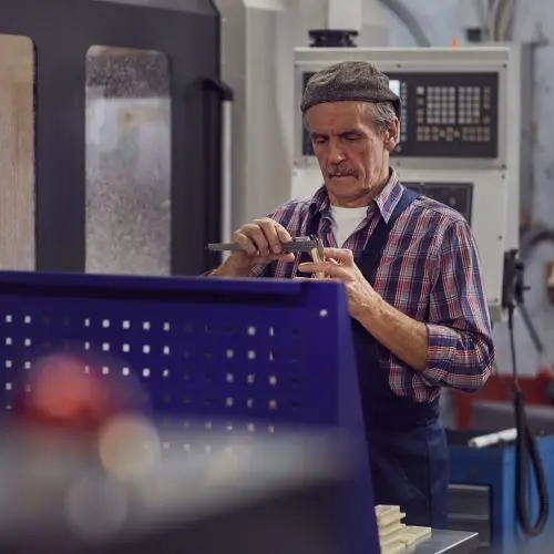 Man inspecting parts 